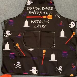 Halloween Baking Apron, kitchen towels and paper baking assortment.